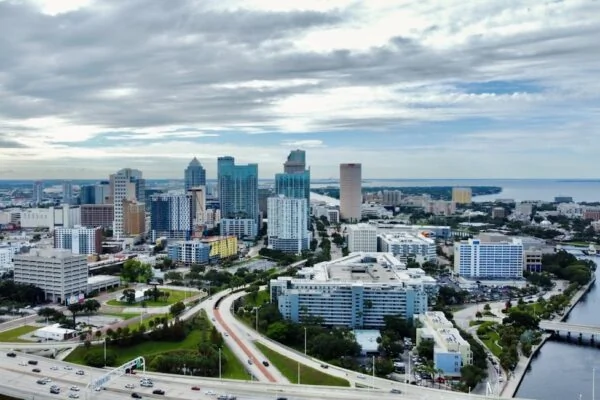 an aerial view of a city with tall buildings