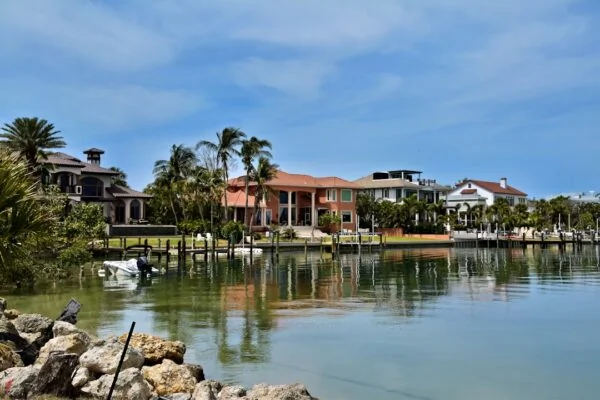 Waterfront houses reflect beautifully in the water.