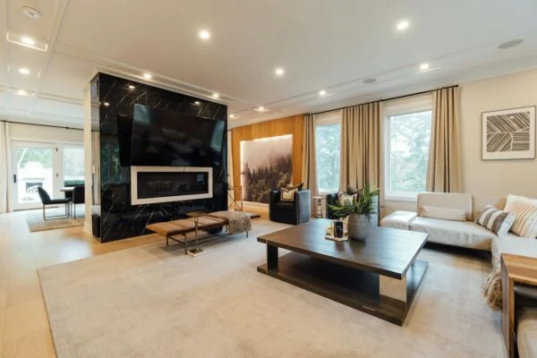 a living room with a couch, coffee table and television
