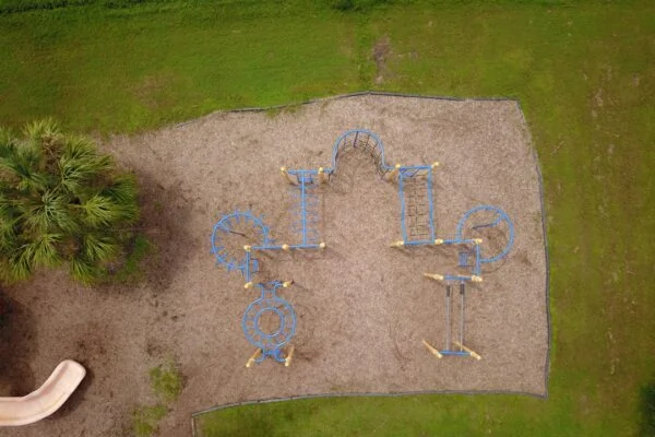 an aerial view of a playground in a park