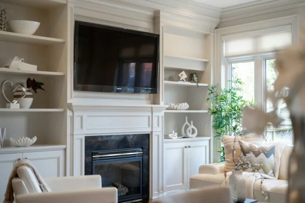 Living room with fireplace and built-in shelves