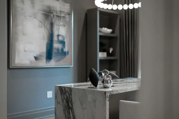 Modern office with marble desk and abstract art