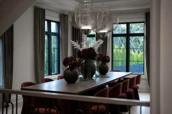 Elegant dining room with large table and red chairs
